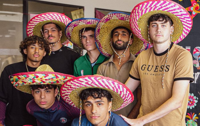 NAU soccer players smiling with sombreros